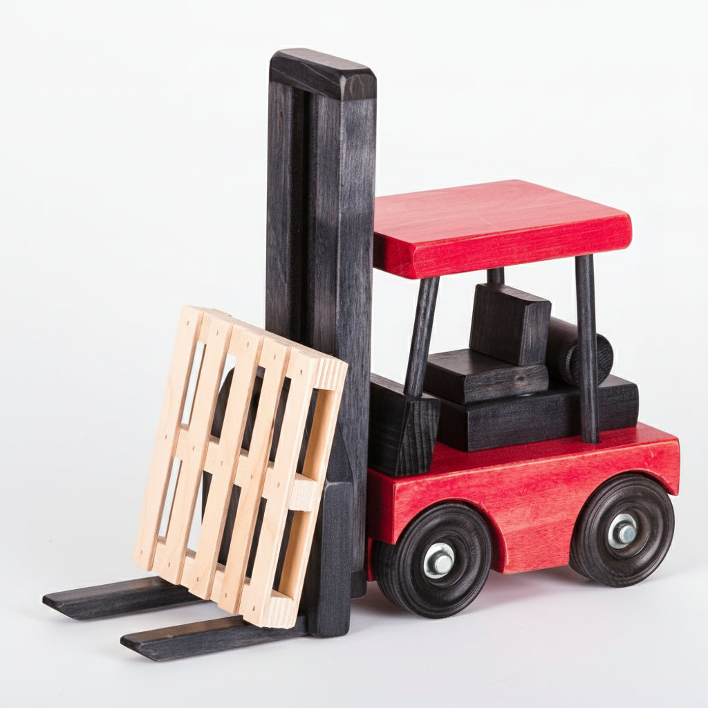 Wooden toy forklift with red body and black forks on a white background
