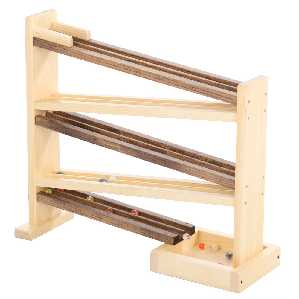 Wooden toy with multiple tracks and balls on a white background