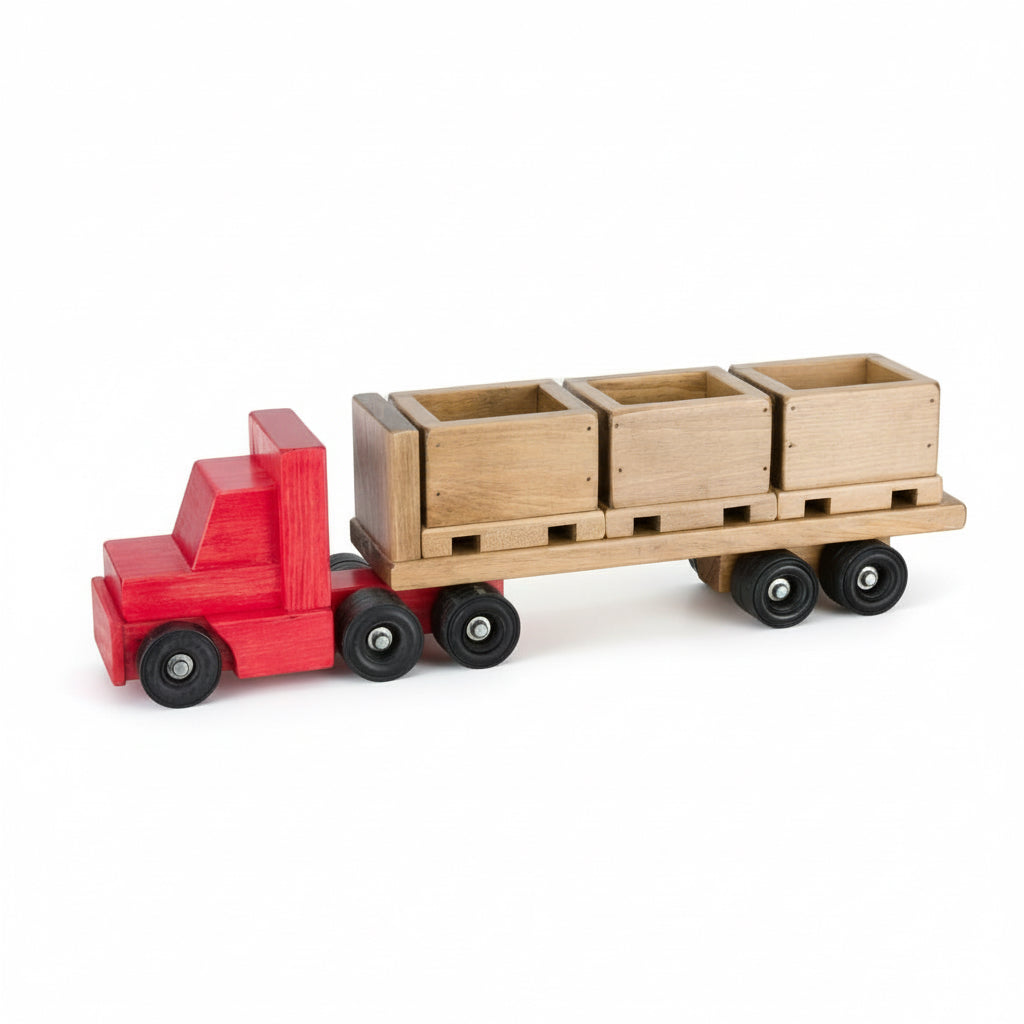 Wooden toy truck with red cab and brown trailer carrying three wooden boxes on a white background