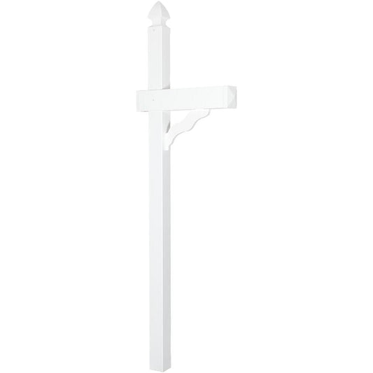 White mailbox on a grassy lawn in front of a brick house