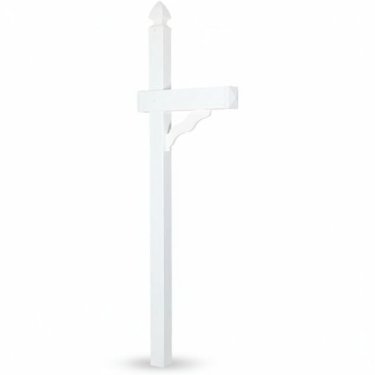 White mailbox on a grassy lawn in front of a brick house